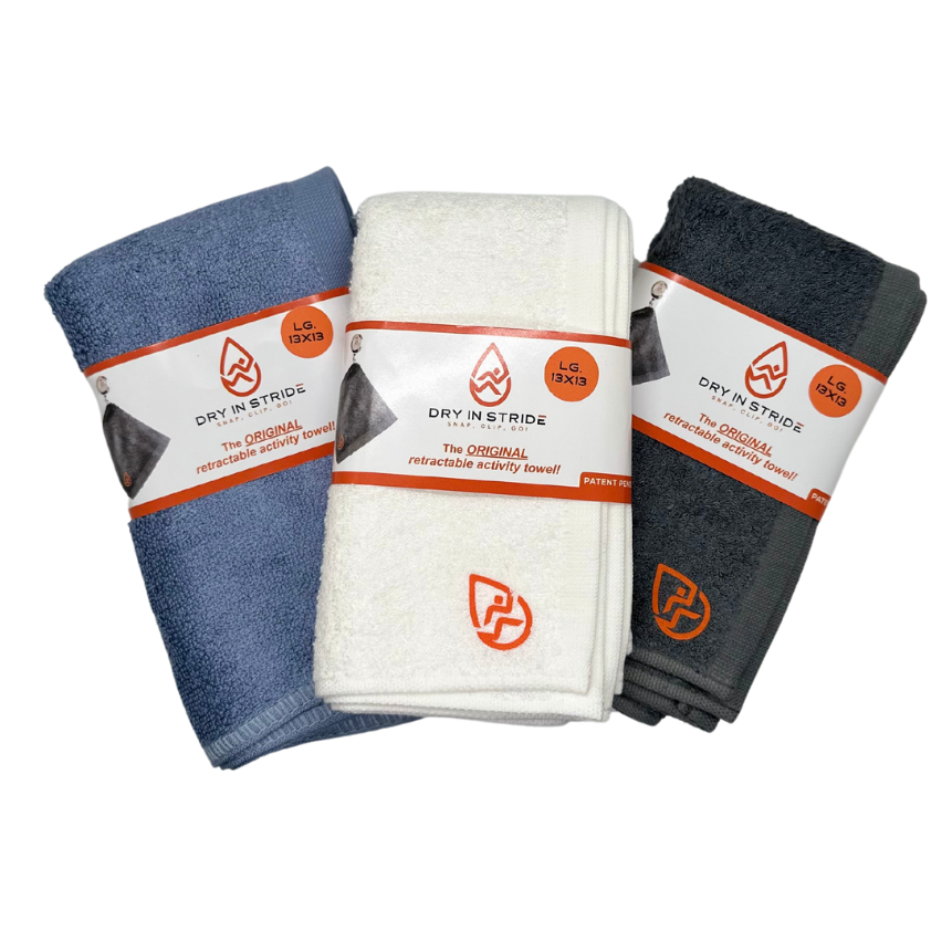 Collage of Denim Blue, White, and Dark Grey large Dry in Stride towel sets on white background. 