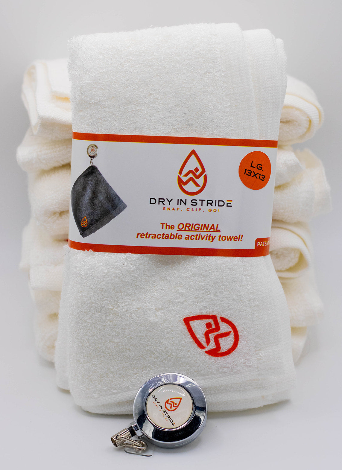 Dry in Stride large towel set in color white with clip showing. 